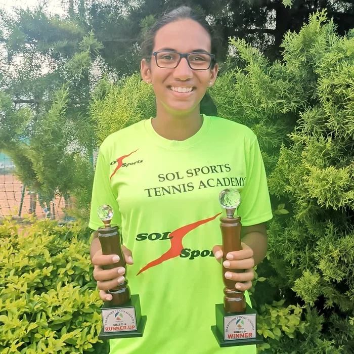 Sol Sports player with trophy