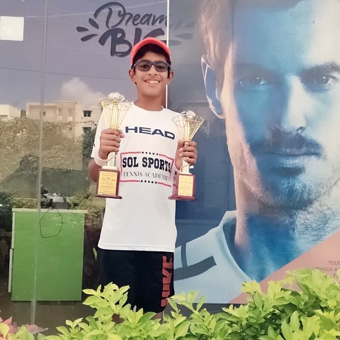 Sol Sports player with trophy