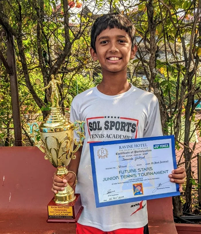 Sol Sports player with trophy