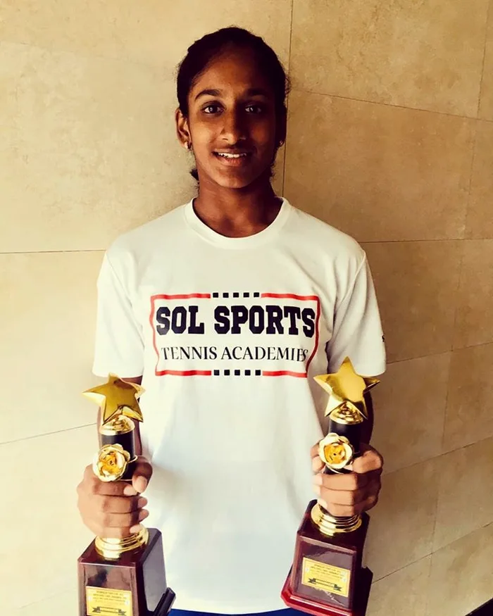 Sol Sports player with trophy