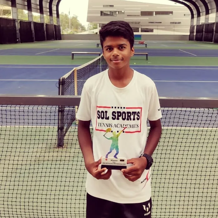 Sol Sports player with trophy