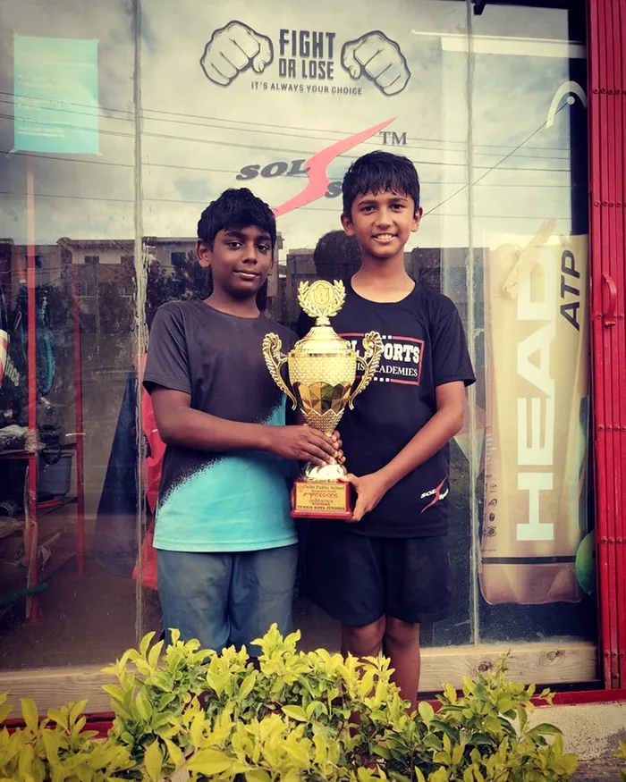 Sol Sports player with trophy