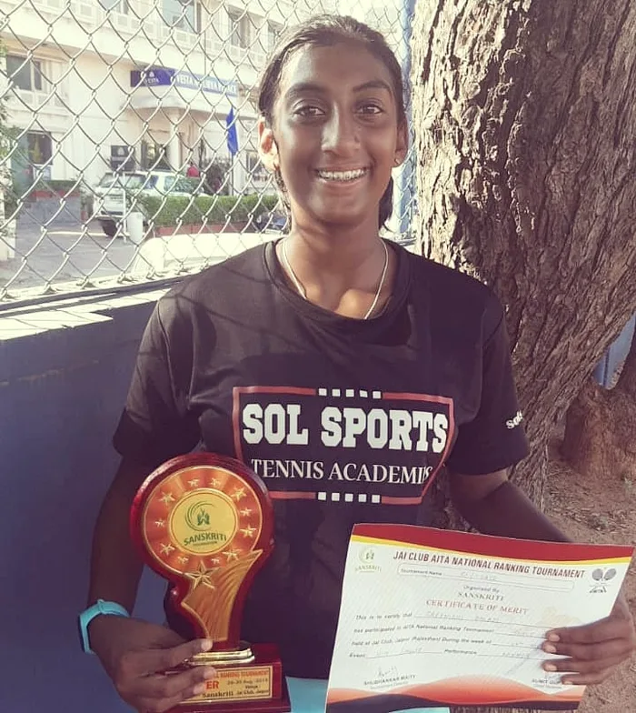 Sol Sports player with trophy